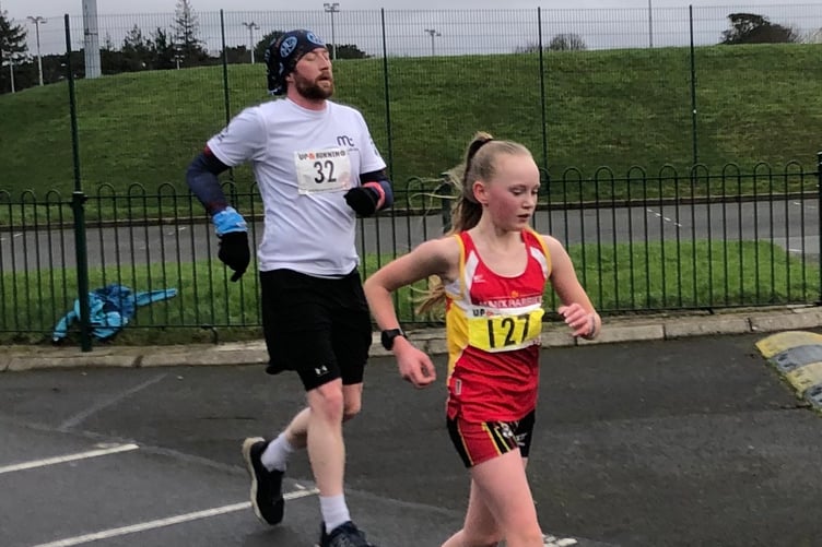 Lilee Fletcher in full stride on her way to finishing joint second with Holly Salter in the 5km race at the NSC (Photo: Steve Partington)