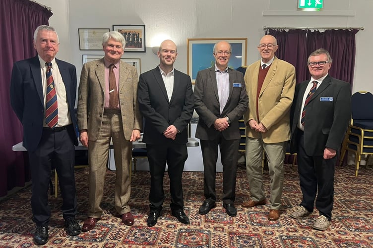 Dion Jones (centre left) with President John Watterson (centre right) alongside other members of the Probus Club of Rushen