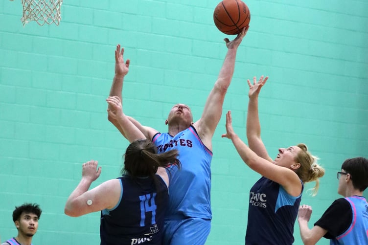 Mikey Brereton secures the rebound for Pirates against tough Hoops competition (Photo: Martin Dunne)