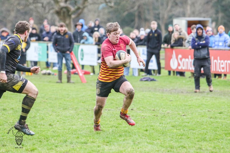 Douglas form man Harry Hewson in action against Burnage (Photo: Richard Ebbutt)