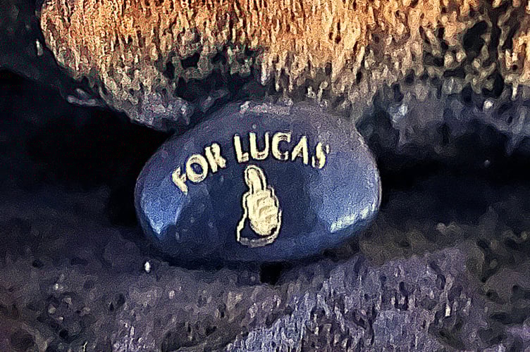 Brett placed this memorial pebble at the top inscribed for his son Lucas