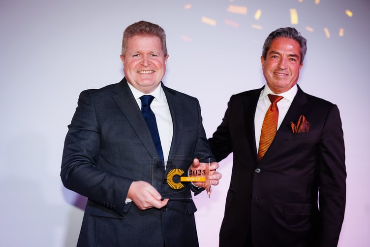 JTC’s IoM managing director Aidan Davin (left) being presented with the trophy by award sponsor Joshua Rubenstein, partner at Katten Muchin Rosenman