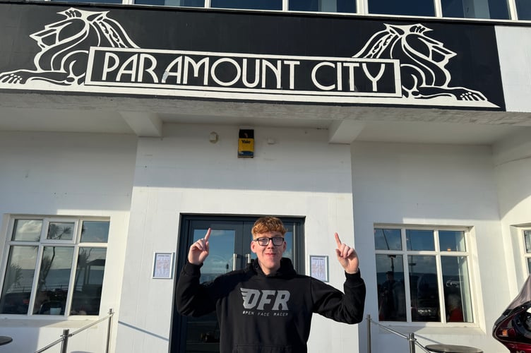 Illiam outside the Quaye family business Paramount City