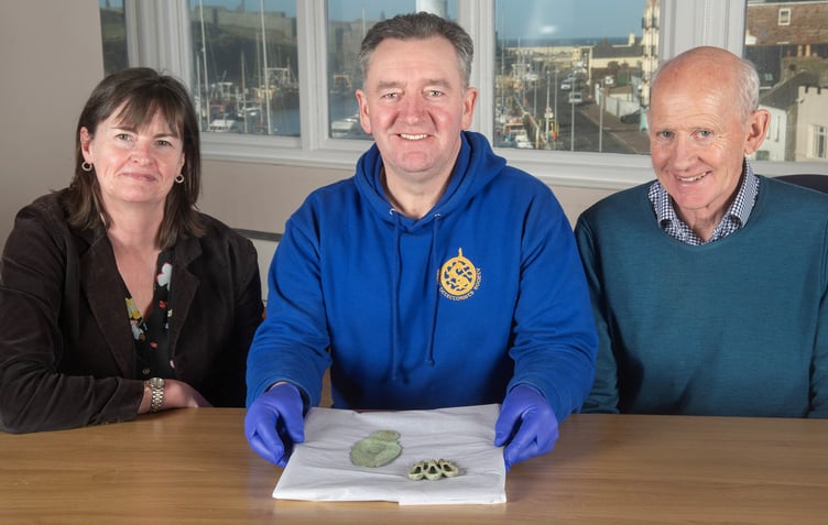 Manx National Heritage curator Allison Fox, finder Rob Middleton and landowner David Anderson with the Iron Age finds