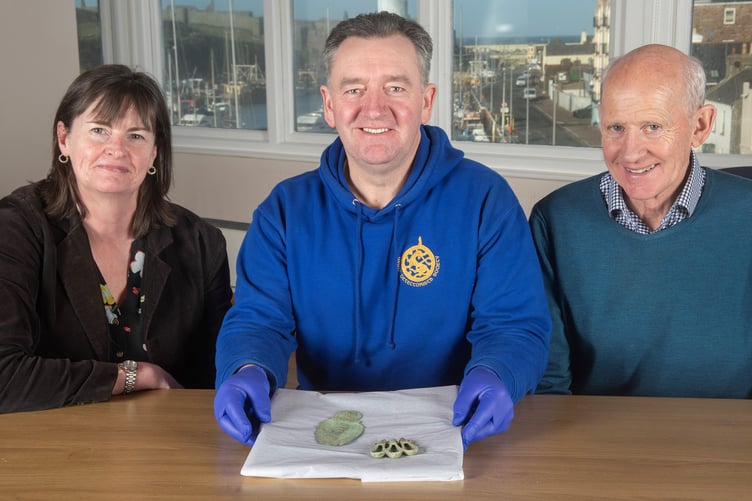 Manx National Heritage curator Allison Fox, finder Rob Middleton and landowner David Anderson with the Iron Age finds