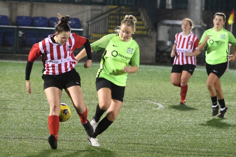 Peel's Maxine Jones (left) and Corinthians' Chloe Teare compete for the ball during Saturday evening's Floodlit Cup final at the Bowl (Photo: Paul Hatton)