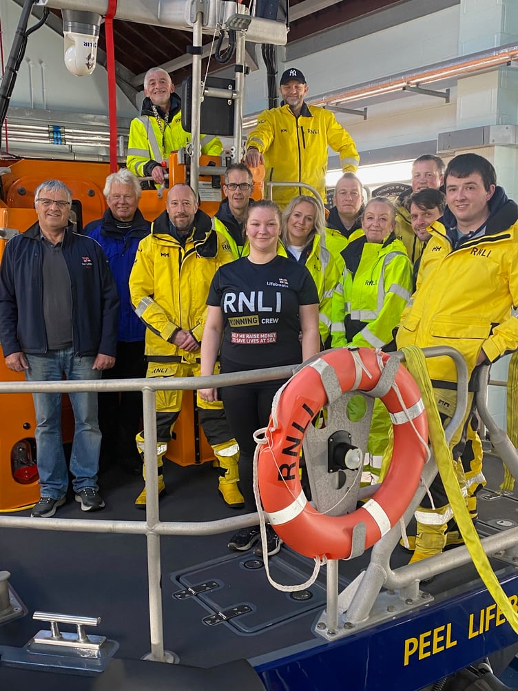Libbie is in the centre of the group of Peel Lifeboat volunteers who have come out to show their support for her Marathon challenge