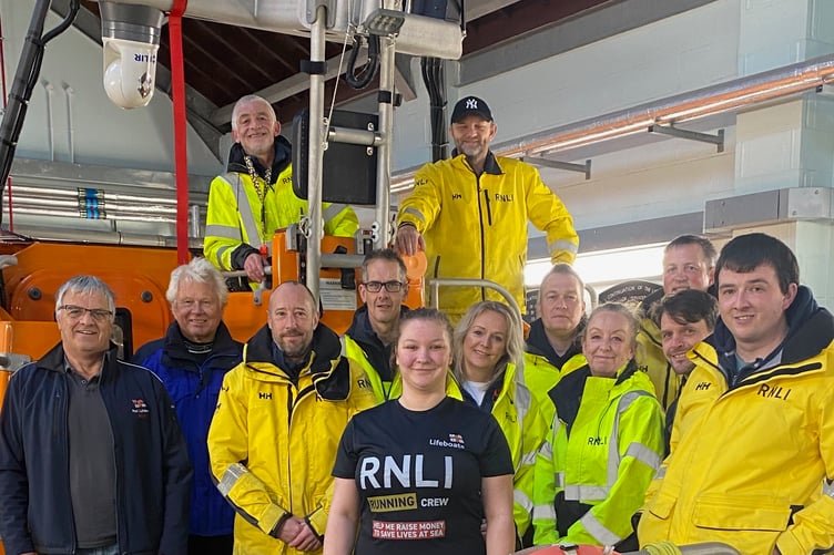 Libbie is in the centre of the group of Peel Lifeboat volunteers who have come out to show their support for her Marathon challenge