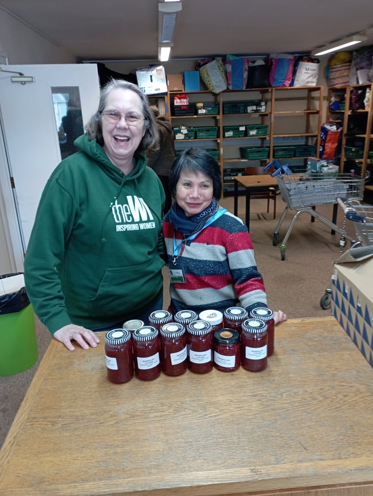 Angela, a’ jam maker’ member of the Isle of Man Women’s Institute, and Marge, Isle of Man Foodbank, were all smiles celebrating the 1000th jar of jam made by the collaboration between local supermarkets