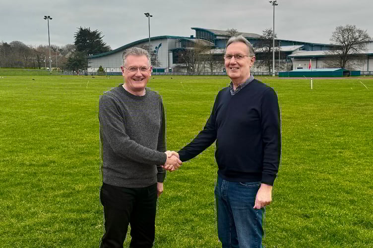 Andy Varnom (on the right) handing over to Gary Weightman as general secretary of the International Island Games Association (IIGA)