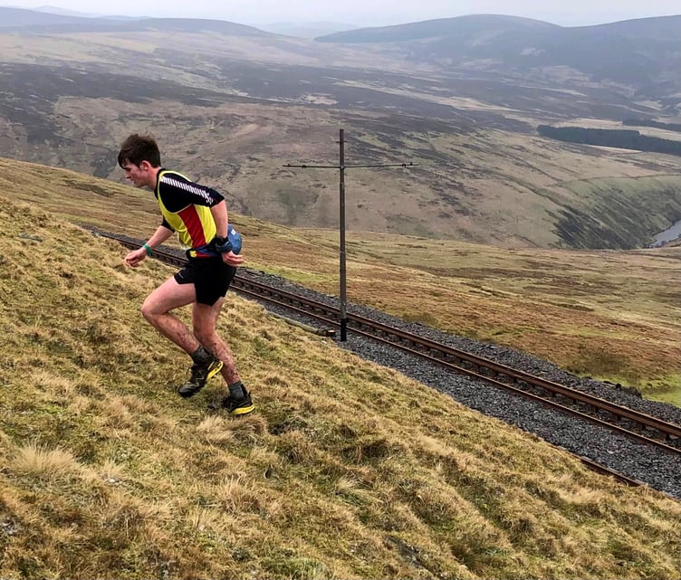 Harry Kneen on his way to victory in the latest round of the Callin Wild-sponsored fell running league over the Snaefell Tholtans route last weekend (Photo: Steve Partington)