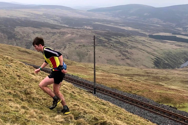 Harry Kneen on his way to victory in the latest round of the Callin Wild-sponsored fell running league over the Snaefell Tholtans route last weekend (Photo: Steve Partington)