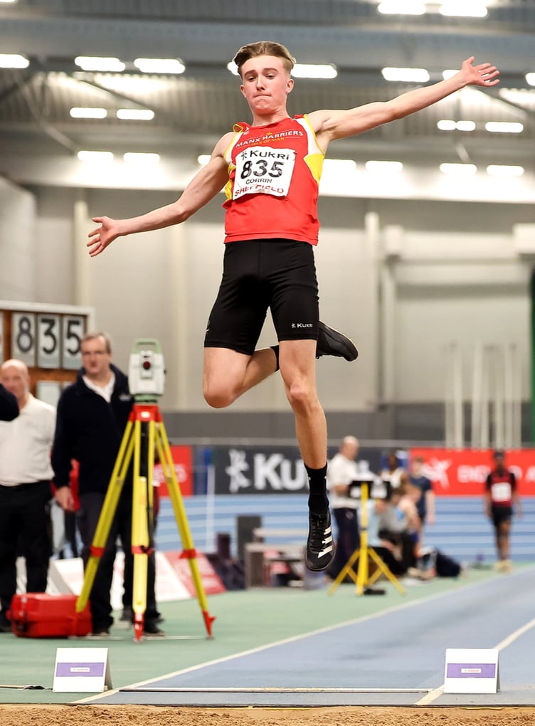 Isle of Man athlete Regan Corrin leaps through the air on his way to winning the gold medal in the under-20 men's long jump at the England Athletics Indoor Track and Field Championships in Sheffield last weekend (Photo: Pat Scaasi)