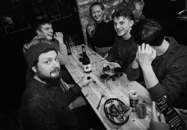 Attendees at one of the Smoky Sam's soft launches enjoy the wide array of food and drink (photo - Hannah McHugh)