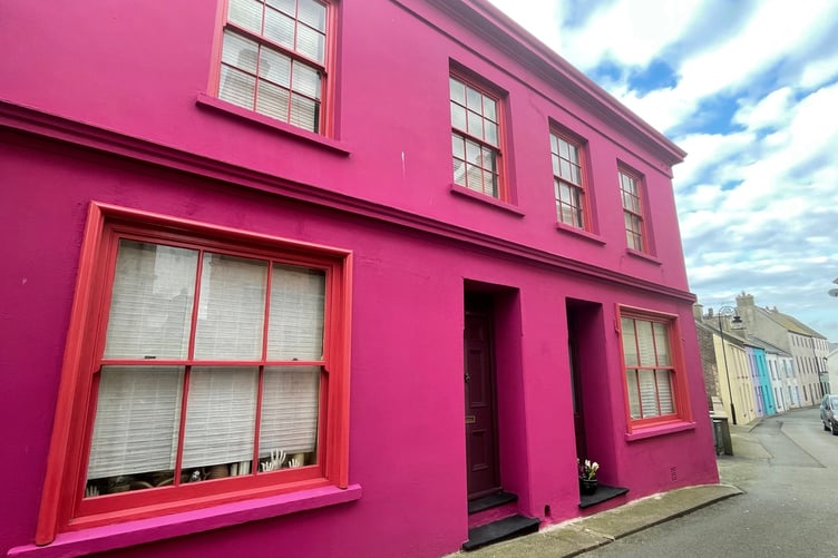 Vivid pink house on Castle Street in Peel
