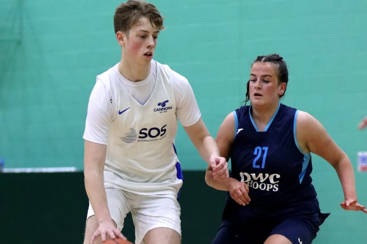Jack Wilkinson drives through the key for Cannons as Hoops' Mairi Harrison covers on defence during the two sides' meeting at the NSC last week (Photo: Martin Dunne)