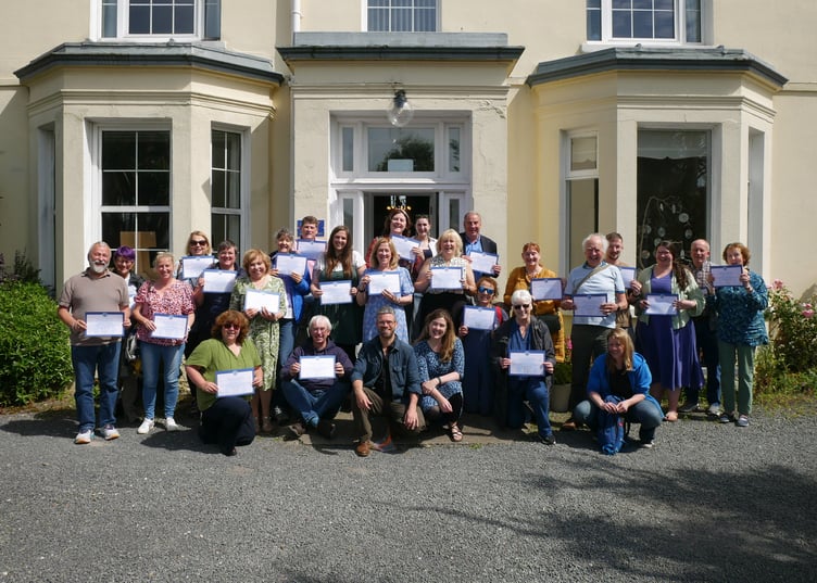 Summer school attendees with their certificates in 2024