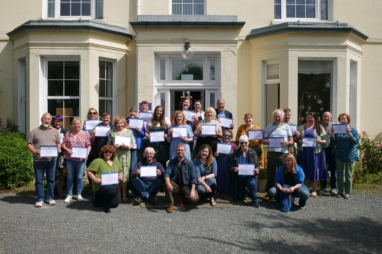 Summer school attendees with their certificates in 2024