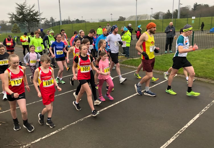 Athletes set off from the startline on the NSC perimeter roadway in Sunday's final round of the Up and Running Winter League, which also incorporated the Manx age group championships (Photo: Steve Partington)