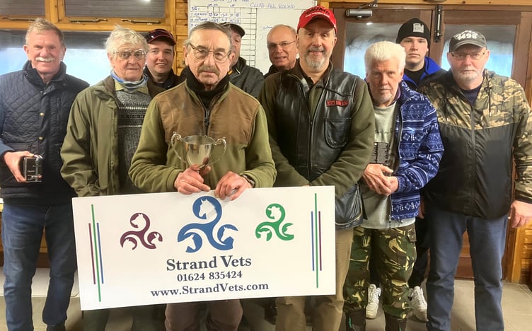 Competitors in Isle of Man Clay Pigeon Shooting Club’s All Round Championship at Meary Veg on Sunday, including overall winner John Moore holding the trophy