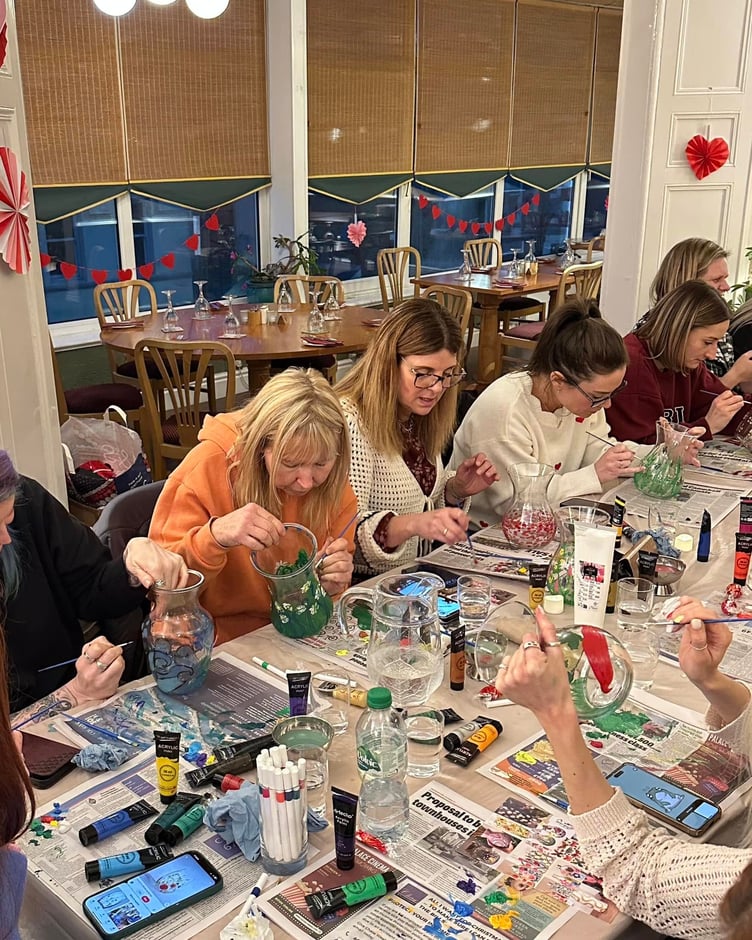 Participants are hard at work on their decorative vases