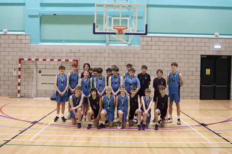 The Junior basketball finalists, Castle Rushen High School and King William's College. CRHS played a solid defensive game to win out 44-26.