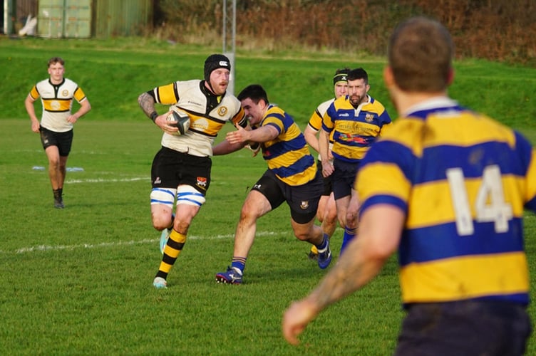 Vagabonds’ Gavin Turnbull attempts to hold off a Burnley player while on a charge during a recent match at Ballafletcher (Photo: John Liver/Mumble's Pics)