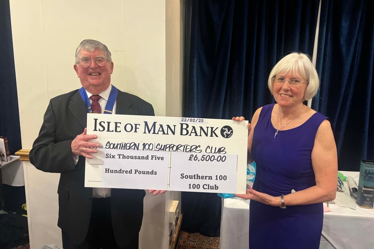 Southern 100 club president Phil Taubman MBE receives a cheque from Brenda Rothwell for £6,500 (Photo: Callum Staley/CJS Photography)