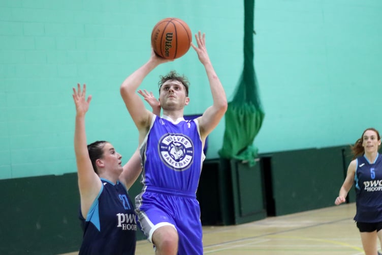Max Edwards of Wolves goes to the hoop for a fast break lay-up against Hoops at the NSC last Thursday