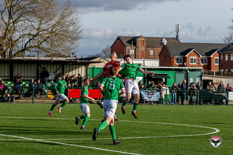 FC Isle of Man's Sean Doyle wins a header against Burscough on Saturday afternoon (Photo: Hannah McHugh)