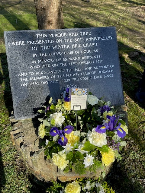 The laid wreath and plaque in St John's