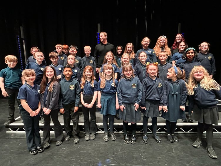 The Ballacottier Primary School choir alongside Russell Watson