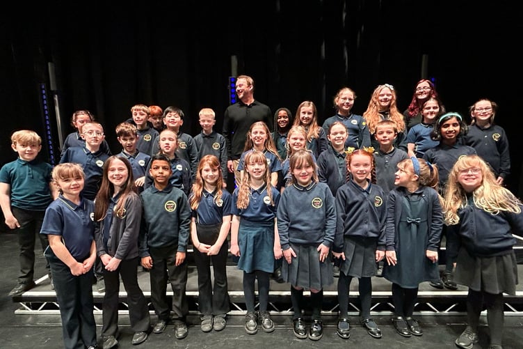 The Ballacottier Primary School choir alongside Russell Watson