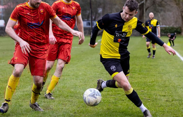 Ashley Higginbotham (right) starred for St George's against his former club Marown in the Canada Life Premier League last Saturday, scoring a goal to seal the Crosby side's relegation to Ardern and Druggan Division Two (Photo: Gary Weightman)