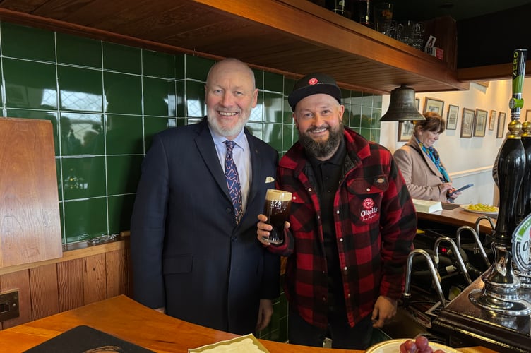 Lieutenant Governor, Sir John Lorimer KCB DSO MBE pulled the first pint of Smoked Porter. Pictured with Okell's Brewery head brewer Kevin Holmes 
