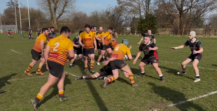 Douglas Rugby Club's Conor Garland (No.4) thunders through the Crewe and Nantwich defence during Saturday's Regional Two North West clash (Photo: Ben Eggleshaw)