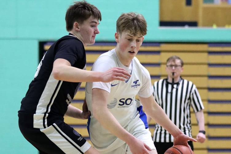 Jack Wilkinson drives against the defence of Logan Glover. during last week's league meeting at the NSC. Glover’s defence and flurry of steals was a key factor in Jets' victory (Photo: Martin Dunne)