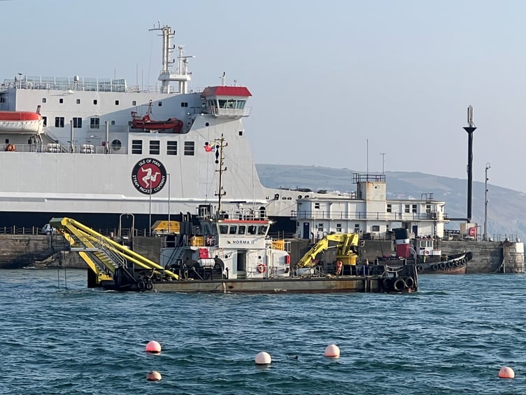 Dredger Norma II at work in Douglas harbour