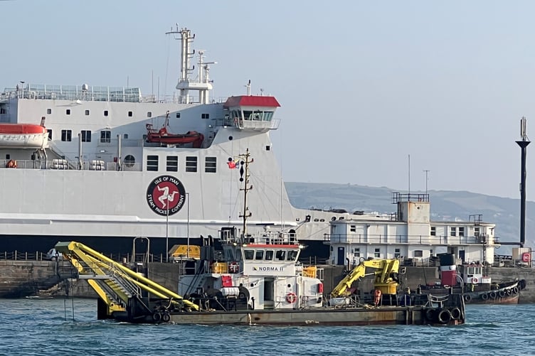 Dredger Norma II at work in Douglas harbour