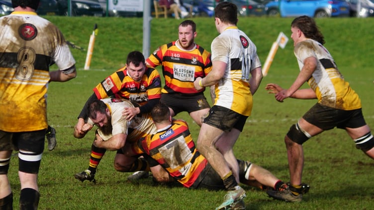 Vagabonds' Jon Ferguson is tackled by several Ashton opponents during the two sides' recent clash at Ballafletcher (Photo: John Liver/Mumble's Pics)