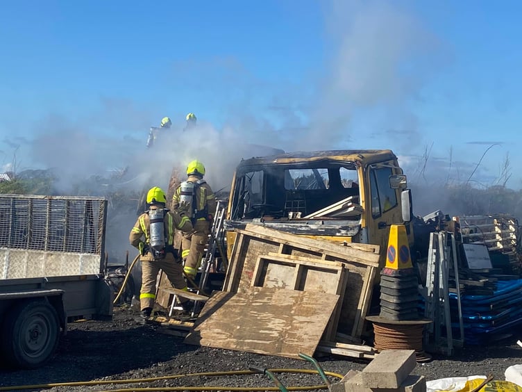 Fire crews attending to the vehicle fire