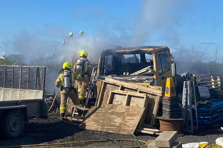 Fire crews attending to the vehicle fire