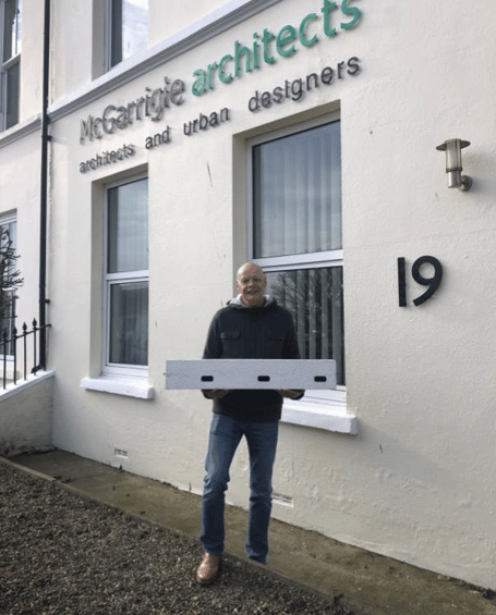 Niall McGarrigle holding a Genesis swift box