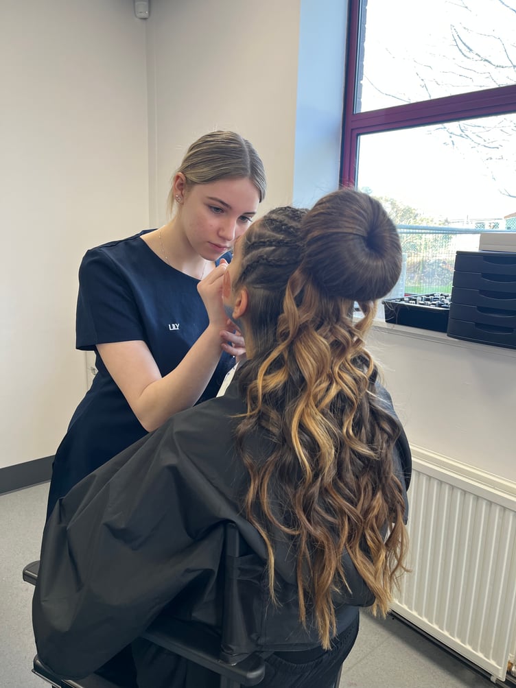 A beauty student in action