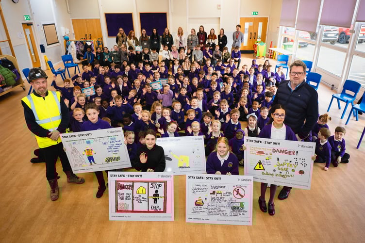 Ballasalla School prizewinners with pupils, teachers and Paul Roberts