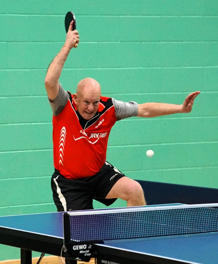 John Magnall blasting a winning forehand on his way to three wins for Arbory B last week (Photo: Malcolm Lambert)