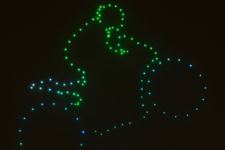 A TT bike is created by the drones during the display