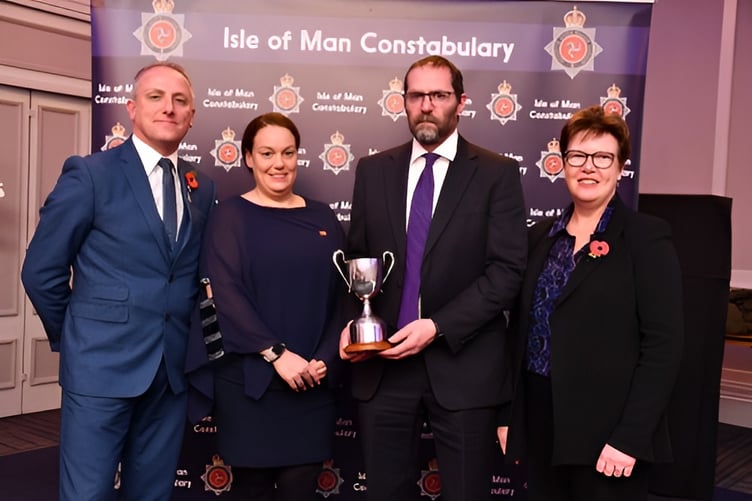 Pictured (left to right) are Gary Thomas, Natasha Stephenson, Ian Hughes from the Mortuary Team and Justice and Home Affairs Minister Jane Poole-Wilson receiving the Community Partnership Initiative Award