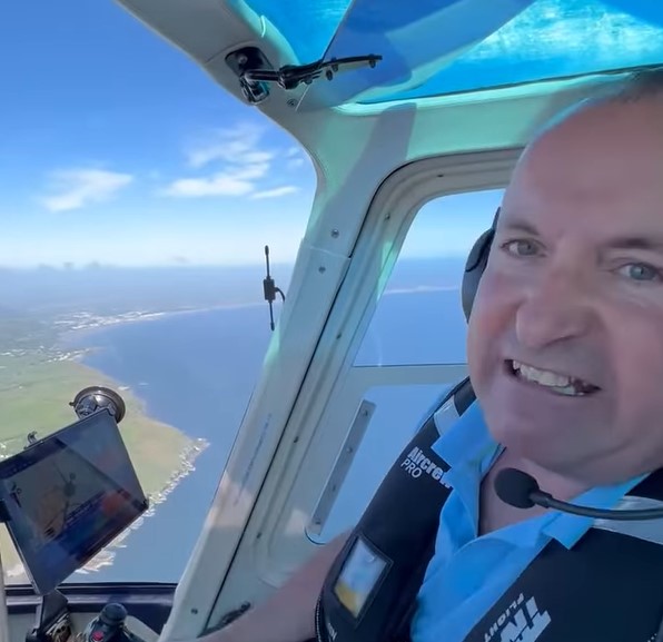 Bank of Dave star David Fishwick flying his helicopter over the Isle of Man