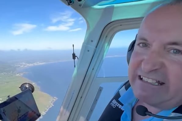 Bank of Dave star David Fishwick flying his helicopter over the Isle of Man